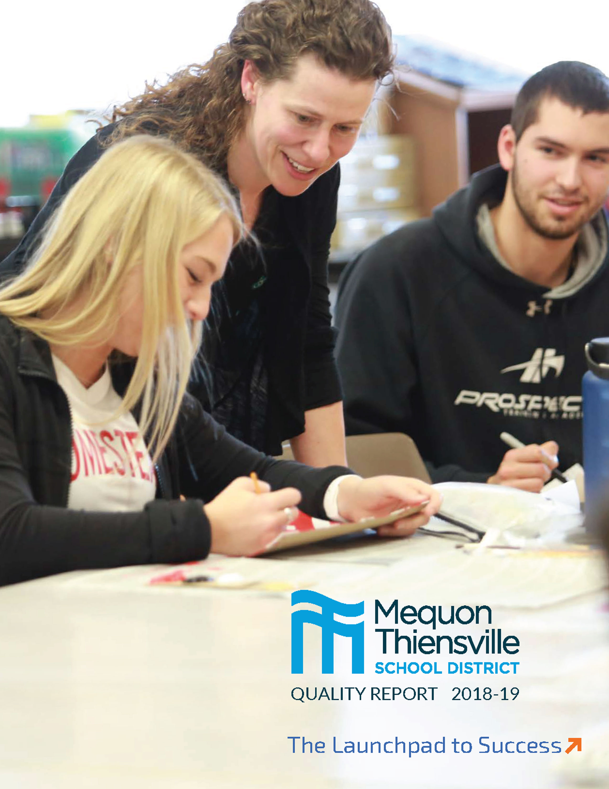 2018-2019 Quality Report cover featuring a teacher and student smiling in an art class and the words "The Launchpad to Success"